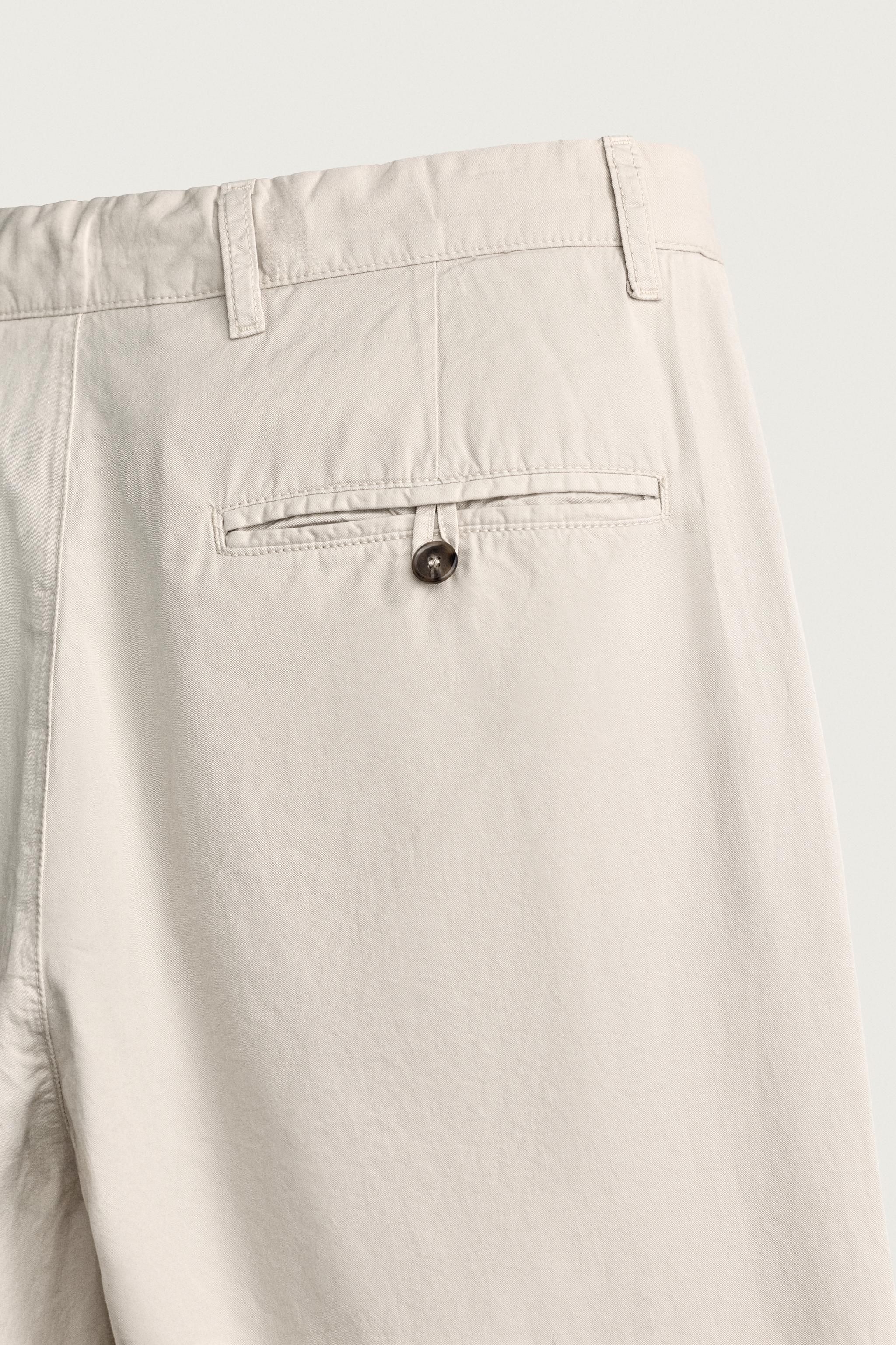 PLEATED STRAIGHT FIT CHINO PANTS